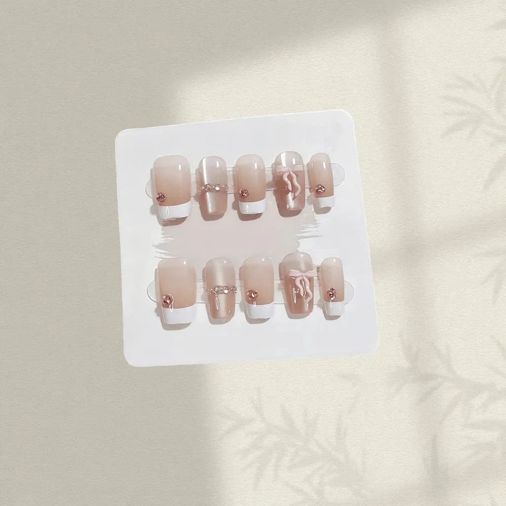 Paznokcie nakładane różowa kokardka krótka trumienka francuski manicure zestaw